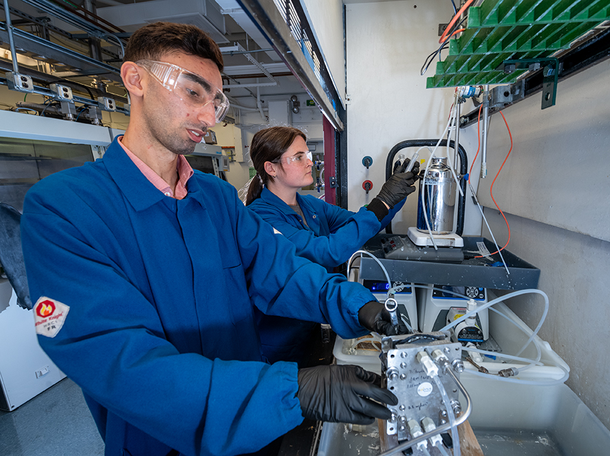 Lukas Hackl and Kate McKessy collaborate on a machine at Aepnus, advancing electrolysis methods at Lawrence Berkeley Lab.