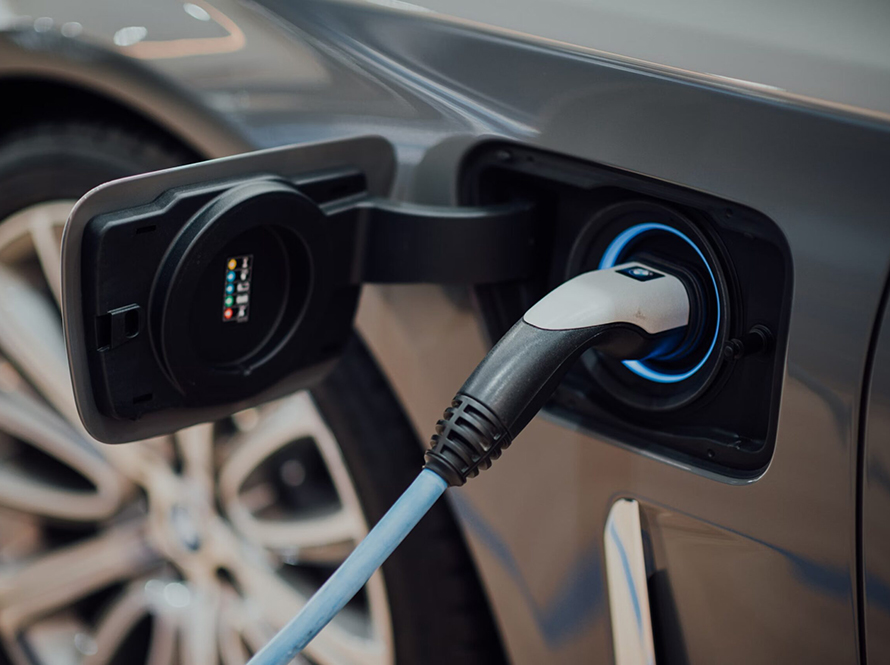 An electric car plugged in and charging.